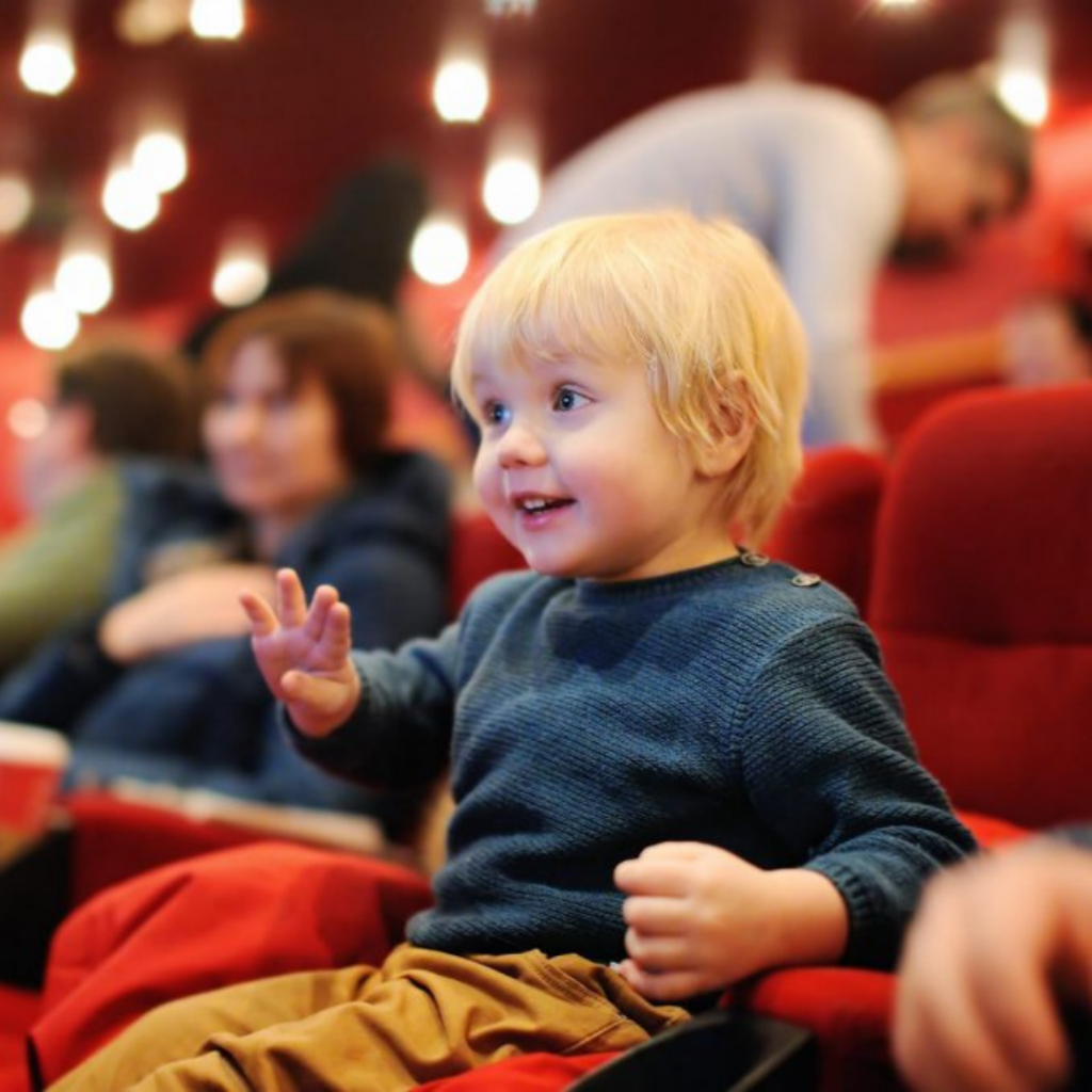 Child sitting in a theatre watching a live events in Mississauga and activities in Mississauga, and puppet show